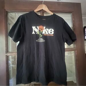 Nike Black Tee with Grow Your Sole Logo.  Black and orange